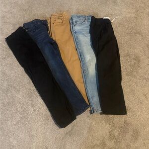 Boys Pants- 5 Pair.  2 Black pants, 2 Pairs of Blue Jeans and 1 Tan Jean